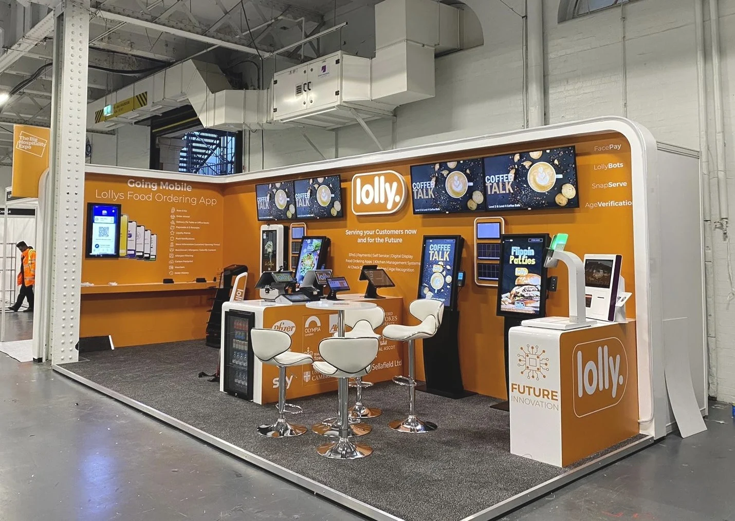 Orange and white Lolly exhibition stand at Olympia